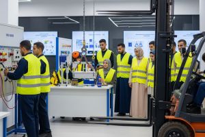 Industrial logistics training with forklift trucks and technical equipment at the training center.