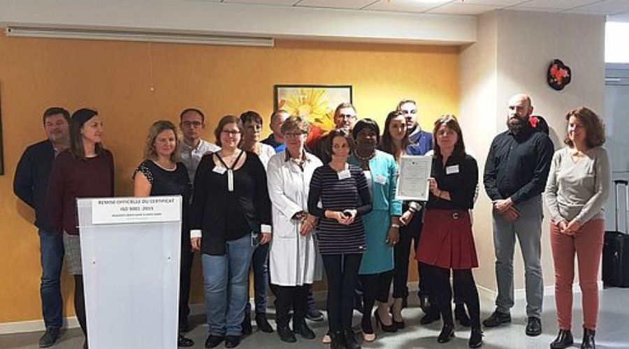 a group of hospital staff get together, one of them holds a certification
