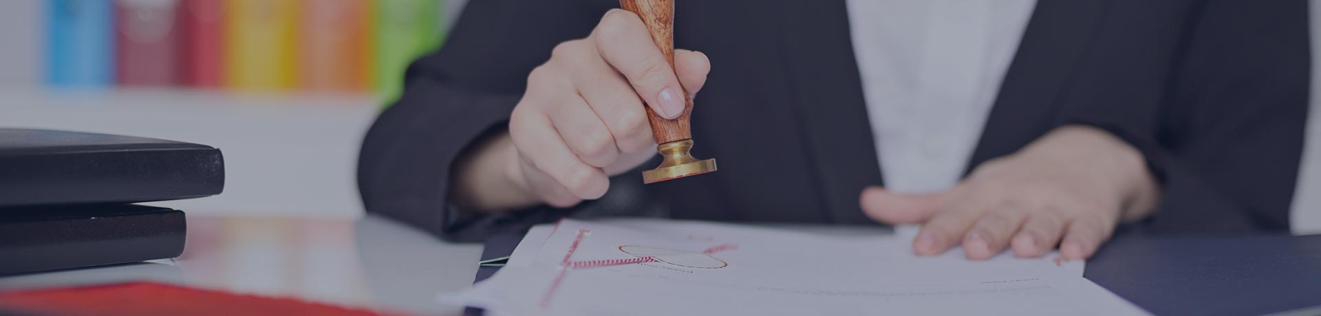 woman putting a stamp on a report