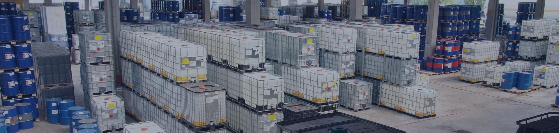 warehouse with chemical goods in containers and barrels