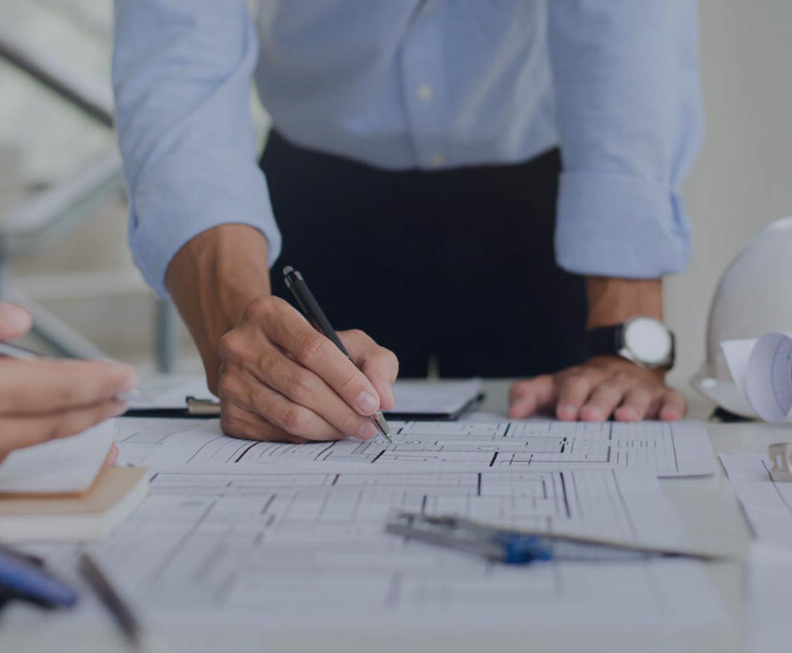Men drafting infrastructures