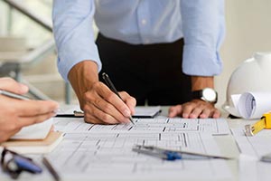 Men drafting infrastructures