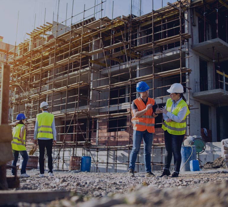 a man and a woman working together on a construction site