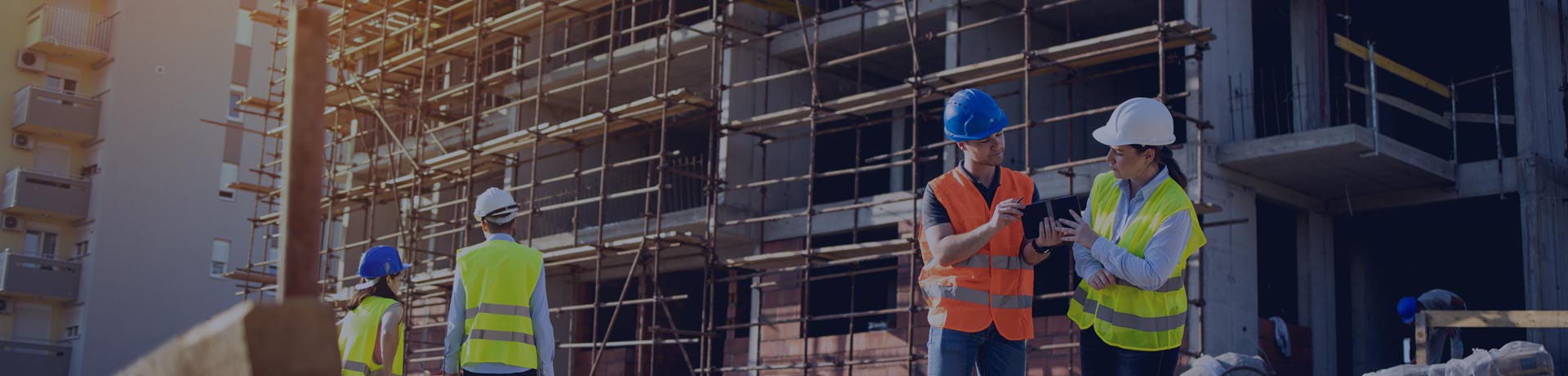 a man and a woman working together on a construction site