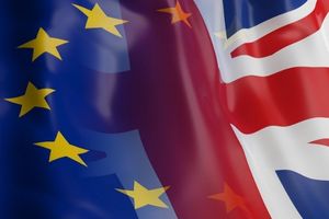  European Union (EU) and United Kingdom (UK) flags overlapping, symbolizing the relationship and politics between the two regions.