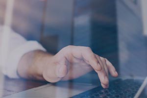 hand on a computer