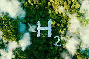 Des arbres et des nuages avec la lettre H et le chiffre 2 pour représenter l'hydrogène