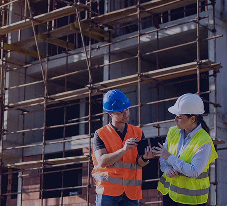 People talking on a construction site