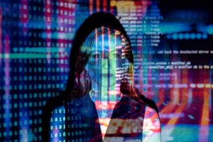 woman's face with lines of code representing digital risk