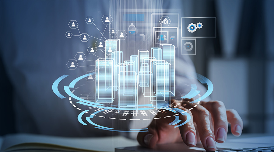 Un homme utilise un clavier pour faire apparaitre une simulation de bâtiment sous forme numérique