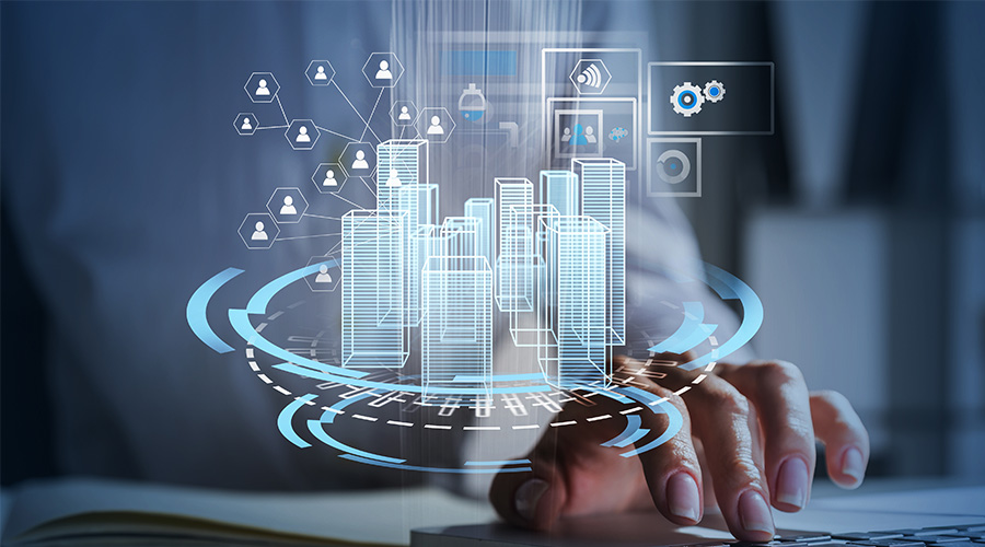 main d'un homme faisant apparaitre un ensemble de bâtiment en virtuel avec des graphiques