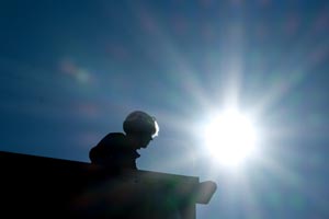 a man with an Apave helmet on a construction site
